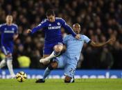 Chelsea's Eden Hazard (C) is challenged by Manchester City's Fernandinho during their English Premier League soccer match at Stamford Bridge in London January 31, 2015. REUTERS/Dylan Martinez