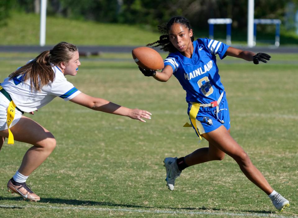 Mainland's Kiera Williams reaches for extra yardage during regional final game with  Somerset Academy at Mainland High School in Daytona Beach, Monday, May 8, 2023. 