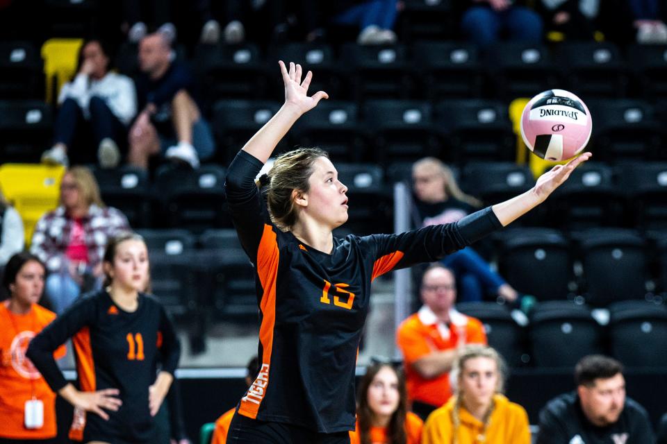 West Des Moines Valley's Elise Jaeger (15) serves during a Class 5A state volleyball semifinal match against Pleasant Valley