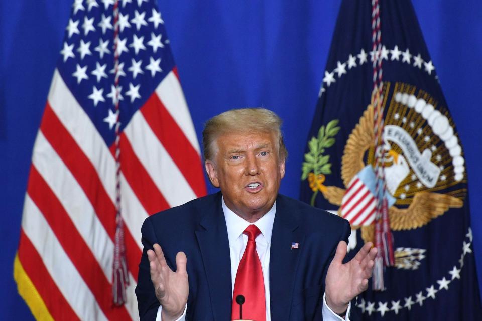 Trump speaks to officials during a roundtable discussion on community safety (AFP via Getty Images)