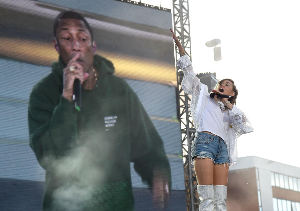 Miley Cyrus performs on stage with Pharrell Williams during the One Love Manchester Benefit Concert at Old Trafford on June 4, 2017 in Manchester, England.&nbsp;