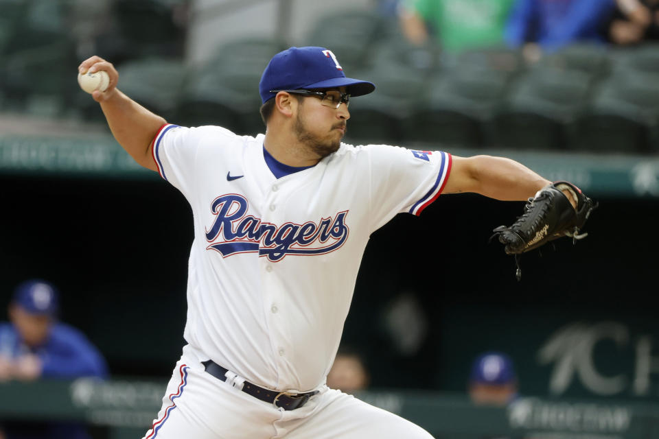 Texas Rangers starting pitcher Dane Dunning throws against the Houston Astros during the first inning of a baseball game Monday, April 25, 2022, in Arlington, Texas. (AP Photo/Michael Ainsworth)