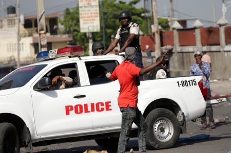 Demonstrators march during a protest to demand the resignation of Haitian president Jovenel Moise, in the streets of Port-au-Prince