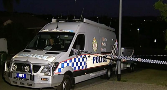 Queensland Police shown at the scene after responding to a report of a shooting about 8.30pm Sunday. Source: 9News