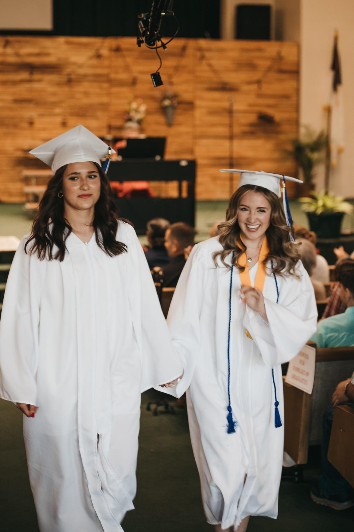 Wooster Christian School's Capri Sohar (left) and Sadie Hinkle were part of the school's first graduating class.