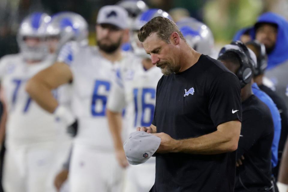 Lions coach Dan Campbell looks down at his hat during the second half of the Lions' 35-17 loss on Monday, Sept. 20, 2021, in Green Bay, Wisconsin.