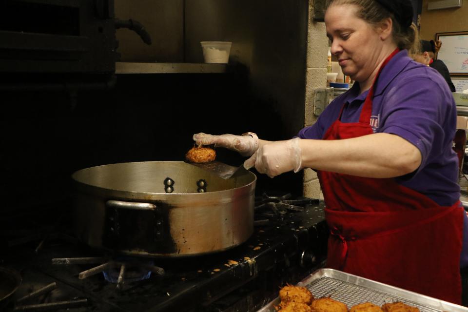 Freda Ronkin, of Bubbie's Market & Deli, Providence, was turning out some 4,000 latkes Thursday in the kitchen at Providence Hebrew Day School.