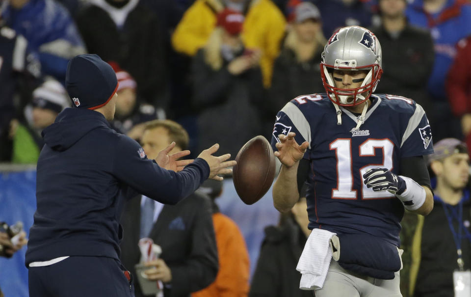 FILE - In this Sunday, Jan. 18, 2015 file photo, New England Patriots quarterback Tom Brady has a ball tossed to him during warmups before the NFL football AFC Championship game against the Indianapolis Colts in Foxborough, Mass. A federal appeals court has ruled, Monday, April 25, 2016,  that New England Patriots Tom Brady must serve a four-game "Deflategate" suspension imposed by the NFL, overturning a lower judge and siding with the league in a battle with the players union.(AP Photo/Matt Slocum, File)