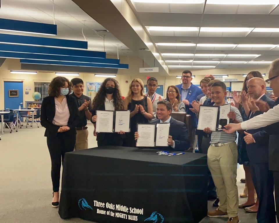 Gov. Ron DeSantis signs three bills into law at Three Oak Middle School in Fort Myers.