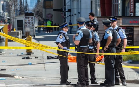 Police in Toronto during the aftermath - Credit: Zumapress