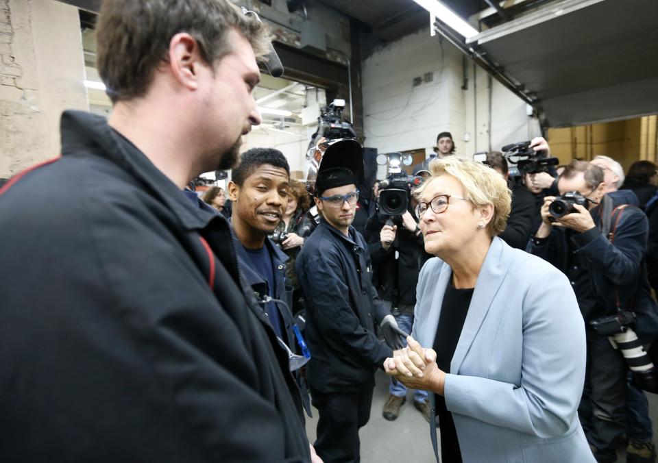 Parti Quebecois leader Pauline Marois (R) greets students at a trade school in Montreal, Quebec, March 14, 2014. Quebec voters will go to the polls in a provincial election on April 7. REUTERS/Christinne Muschi (CANADA - Tags: POLITICS)
