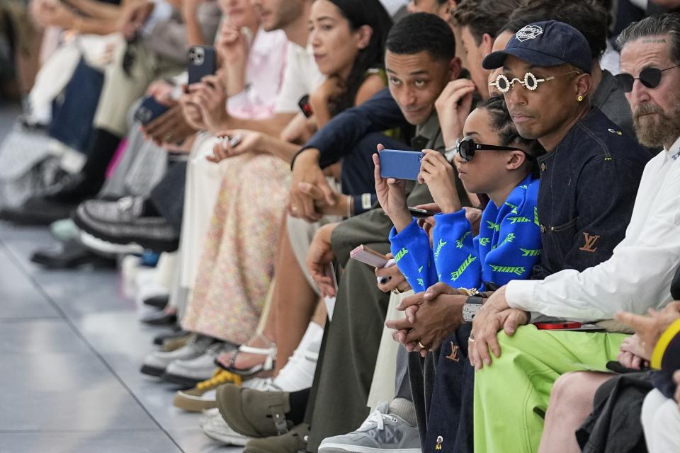 Pharrell Williams, second from right, attends the Dior Menswear Spring/Summer 2024 fashion collection presented in Paris, Friday, June 23, 2023. (AP Photo/Michel Euler)