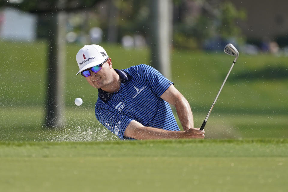 Zach Johnson hits from a bunker on the third hole during the first round of the Honda Classic golf tournament, Thursday, March 18, 2021, in Palm Beach Gardens, Fla. (AP Photo/Marta Lavandier)