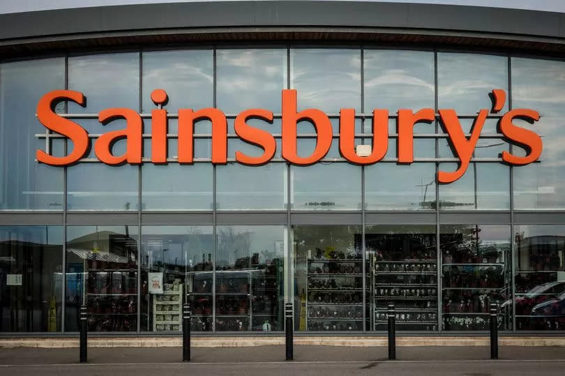 Sainsbury's logo is displayed outside a branch of the supermarket retailer