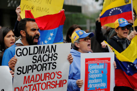 Protesters demonstrate outside of Goldman Sachs headquarters after the company purchased Venezuelan bonds in New York, U.S., May 30, 2017. REUTERS/Lucas Jackson