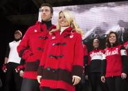 Figure skating pair Kirsten Moore-Towers and Dylan Moscovitch pose during the unveiling of the Canadian Olympic and Paralympic team clothing in Toronto, October 30, 2013. REUTERS/Mark Blinch (CANADA - Tags: SPORT OLYMPICS FIGURE SKATING)