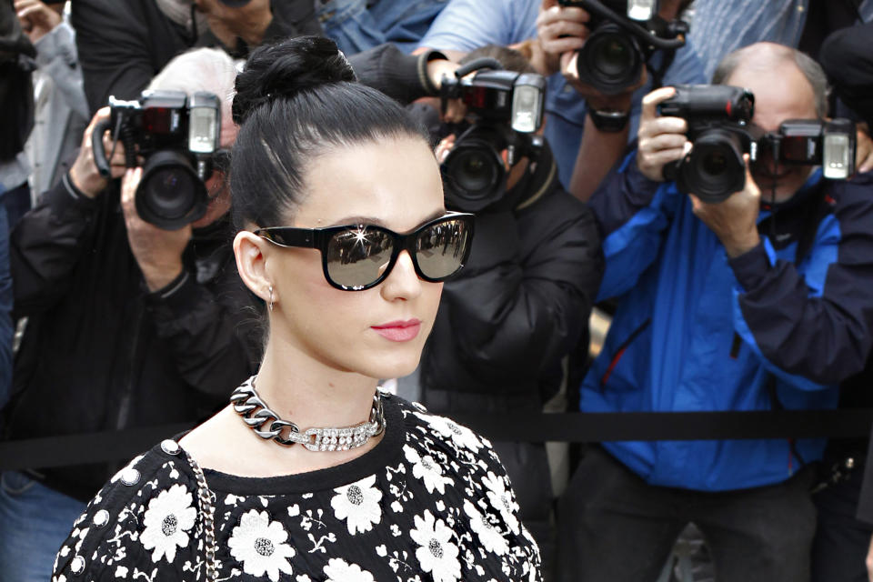 Katy Perry arrives to attend the presentation of Chanel's ready-to-wear Spring/Summer 2014 fashion collection, Tuesday, Oct. 1, 2013 in Paris. (AP Photo/Thibault Camus)