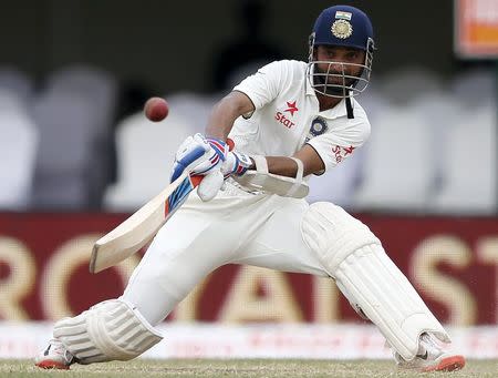 India's Ajinkya Rahane hits a boundary during the fourth day of their second test cricket match against Sri Lanka in Colombo August 23, 2015. REUTERS/Dinuka Liyanawatte