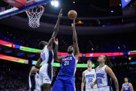 Philadelphia 76ers' Joel Embiid (21) goes up for a shot against Orlando Magic's Bol Bol (10) during the first half of an NBA basketball game, Wednesday, Feb. 1, 2023, in Philadelphia. (AP Photo/Matt Slocum)