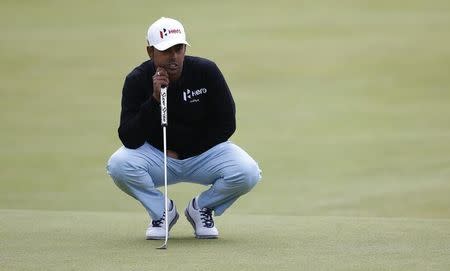 Anirban Lahiri of India lines up a putt on the 18th green during the first round of the British Open golf championship on the Old Course in St. Andrews, Scotland, July 16, 2015. REUTERS/Paul Childs