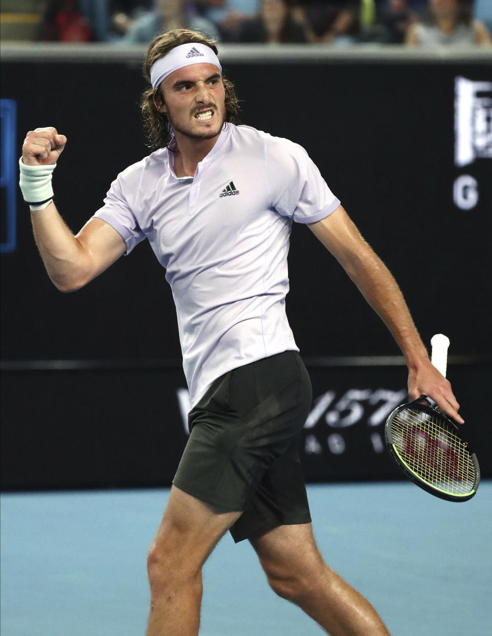 Stefanos Tsitsipas of Greece reacts after defeating Italy's Salvatore Caruso in their first round singles match at the Australian Open tennis championship in Melbourne, Australia, Monday, Jan. 20, 2020. (AP Photo/Dita Alangkara)