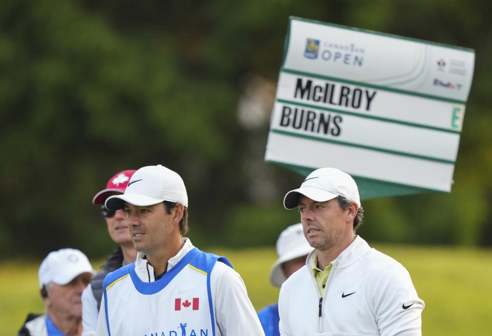 Rory McIlroy, right, looks on after hitting his tee shot on the 10th hole during the Canadian Open Pro-Am in Toronto on Wednesday, June 7, 2023. (Nathan Denette/The Canadian Press via AP)