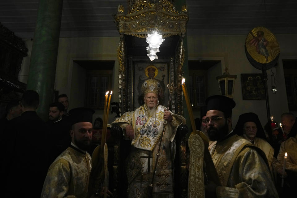 Ecumenical Patriarch Bartholomew I, ecumenical patriarch of the Eastern Orthodox Church, based in Istanbul, conducts Mass at the Church of St. George in the island of Gokceada, Turkey, known as Imvros in Greek, early Sunday, April 16, 2023. The patriarch fulfilled a 10-year promise to mark Easter on the Turkish island where he was born. (AP Photo/Khalil Hamra)