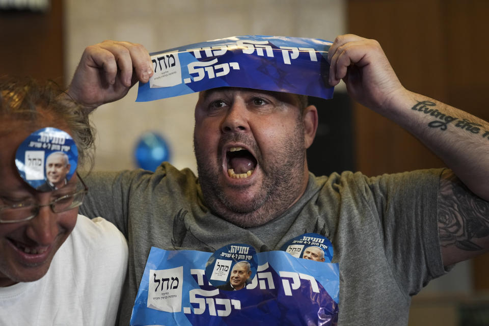 Supporters of Benjamin Netanyahu, former Israeli Prime Minister and the head of Likud party celebrates the first exit poll results for Israel's election, at the Likud party headquarters in Jerusalem, Tuesday, Nov. 1, 2022. (AP Photo/Tsafrir Abayov)