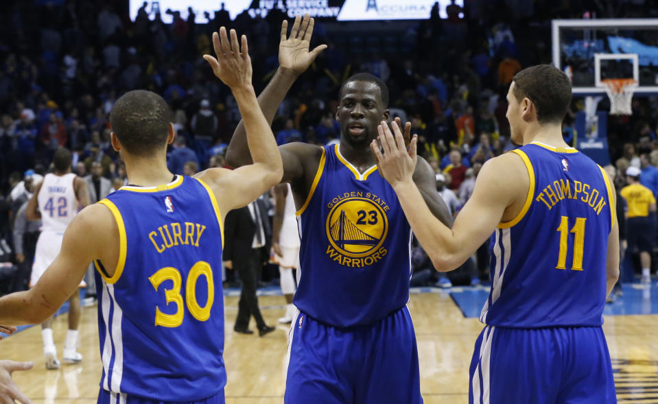 Stephen Curry（圖左起）、Draymond Green與Klay Thompson。（AP Photo/Sue Ogrocki）