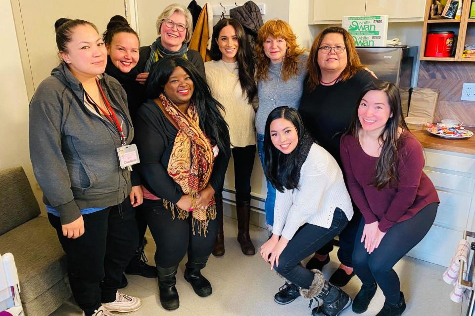 Meghan Markle pictured with women from the centre in Vancouver (Facebook / Downtown Eastside Women's Centre)