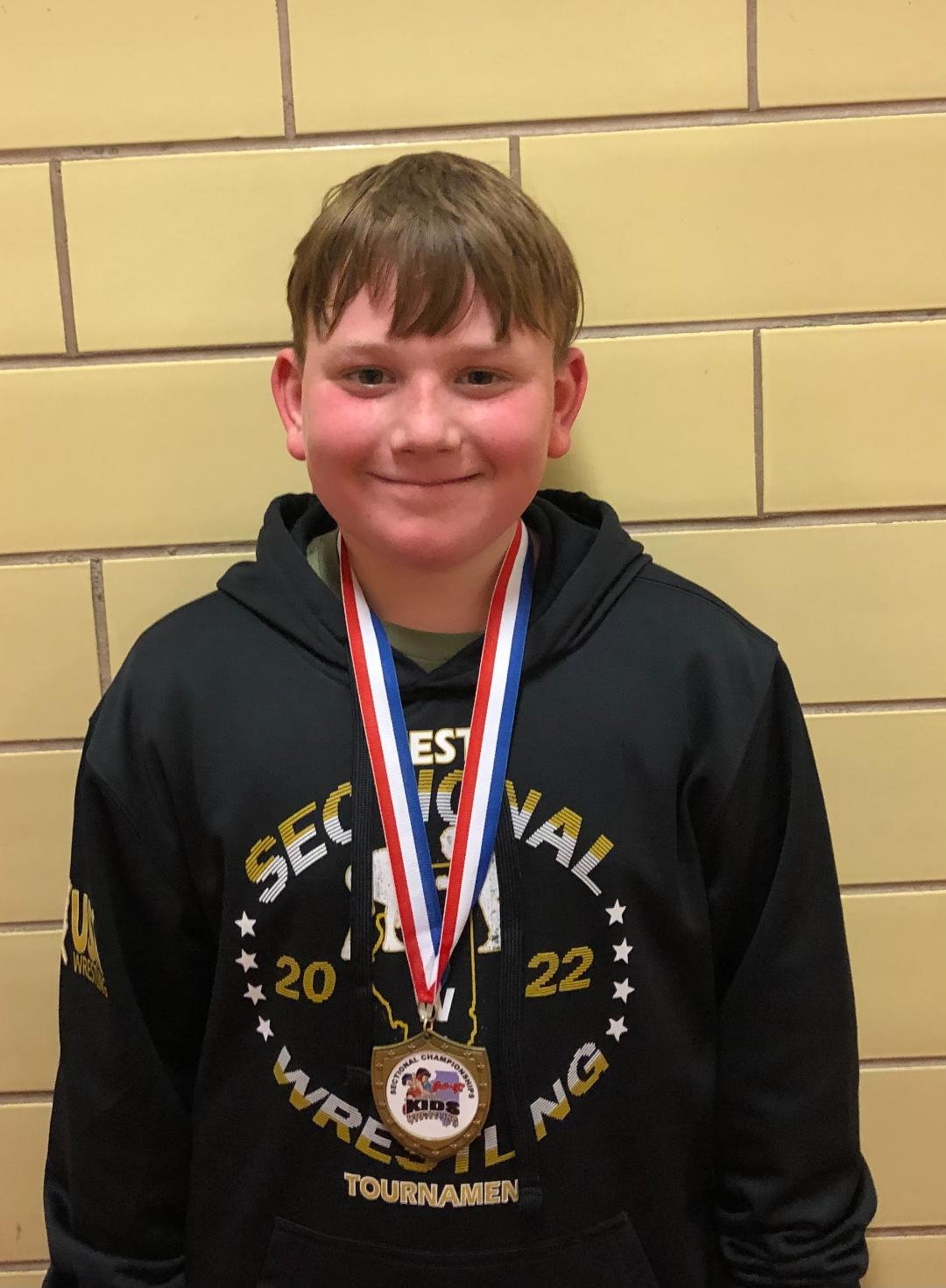 Eli Latimer placed third at 115 pounds—Intermediate Division.