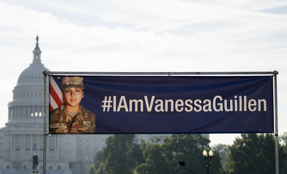 FILE - In this July 30, 2020, file photo, an banner with the image of slain Army Spc. Vanessa Guillen and #IAmVanessaGuillen is displayed before the start of a news conference on the National Mall in Washington. The death of Guillen, who was slain by a fellow soldier at the Texas Army base where they both worked, has been classified as "in the line of duty," according to a report by U.S. Army officials. The results were presented to the Guillén family on Wednesday Oct. 21, 2020. (AP Photo/Carolyn Kaster, File)