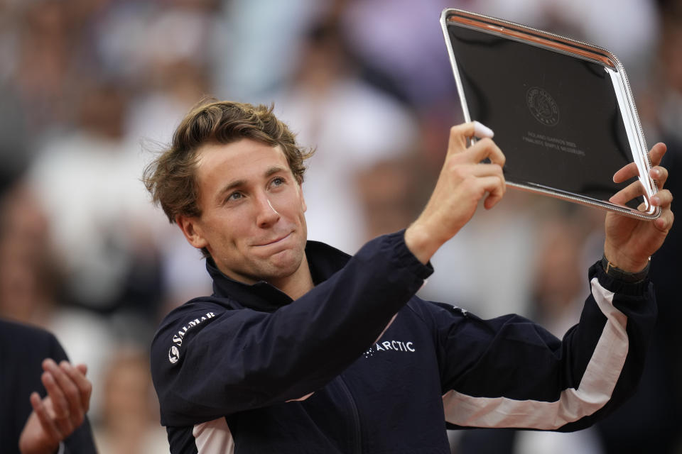 FILE - Norway's Casper Ruud holds the runner-up trophy after losing the men's singles final match of the French Open tennis tournament against Serbia's Novak Djokovic at Roland Garros stadium in Paris, Sunday, June 11, 2023. Ruud is a two-time runner-up at the French Open, which starts Sunday at Roland Garros in Paris. (AP Photo/Christophe Ena, File)