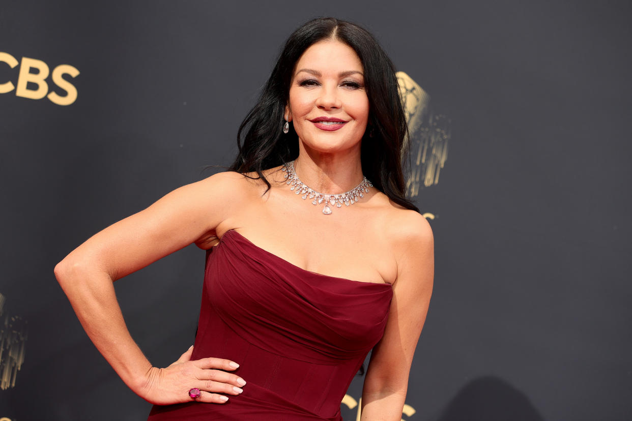 Catherine Zeta-Jones opted for her signature makeup look – sultry smoky eyes and a bold red lip at the 2021 Emmys on 19 September 2021. (Rich Fury/Getty Images)