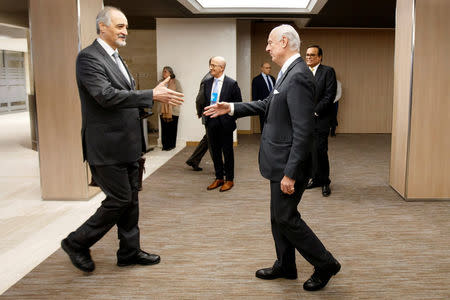 Bashar al-Jaafari (L), Syrian chief negotiator and Ambassador of the Permanent Representative Mission of the Syria to UN New York, shakes hands with UN Special Envoy of the Secretary-General for Syria Staffan de Mistura, right, prior a round of negotiation, during the Intra Syria talks, at the European headquarters of the United Nations in Geneva, Switzerland March 3, 2017. REUTERS/Salvatore Di Nolfi/Pool