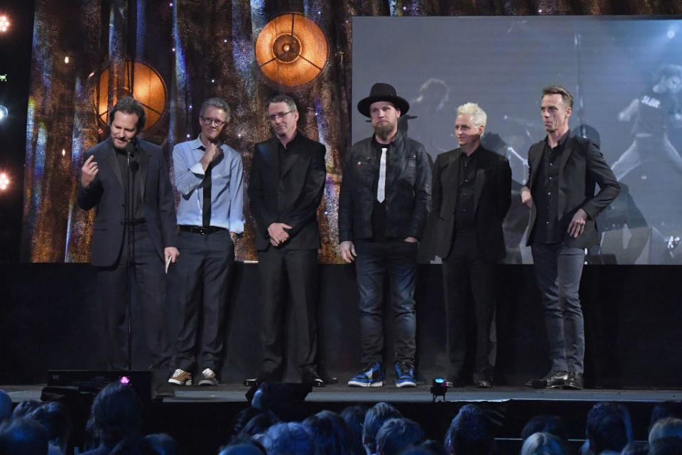 Past and present Pearl Jam members — from left, Eddie Vedder, Dave Krusen, Stone Gossard, Jeff Ament, Mike McCready and Matt Cameron — are inducted into the Rock and Roll Hall Of Fame in 2017. (Photo: Mike Coppola/Getty Images)