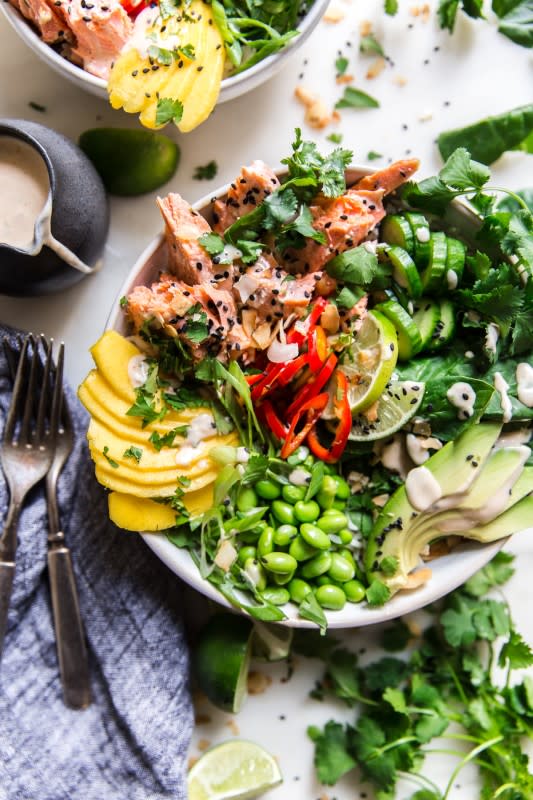 <p>The Modern Proper</p><p>Tender salmon paired perfectly with coconut rice, then topped with avocado, mango, cucumber and a zippy sauce that pulls the whole bowl together.</p><p><strong>Get the recipe: <a href="https://themodernproper.com/coconut-rice-salmon-bowl" rel="nofollow noopener" target="_blank" data-ylk="slk:Coconut Rice Salmon Bowl;elm:context_link;itc:0;sec:content-canvas" class="link rapid-noclick-resp">Coconut Rice Salmon Bowl</a></strong></p>