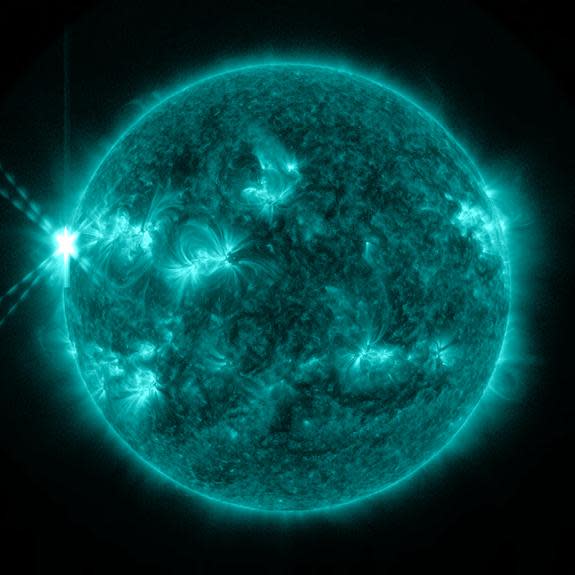 On May 13, 2013, an X2.8-class flare erupted from the sun -- the strongest flare of 2013 to date. This image of the flare, shown in the upper left corner, was captured by NASA's Solar Dynamics Observatory in light of 131 angstroms, a wavelength