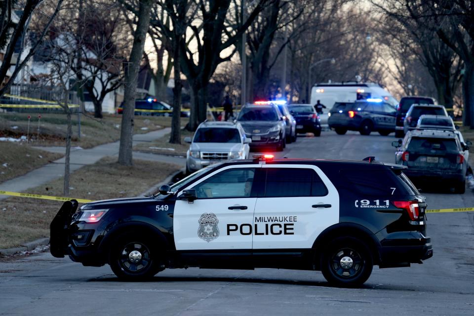 Milwaukee Police officer guards the entrance to the 3900 block  N. 75th street at a double homicide on Friday, Jan  21,2022.