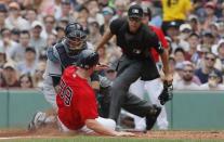 Jul 16, 2017; Boston, MA, USA; Boston Red Sox first baseman Sam Travis (59) tagged out at home plate by New York Yankees catcher Austin Romine (27) in the second inning at Fenway Park. Mandatory Credit: David Butler II-USA TODAY Sports