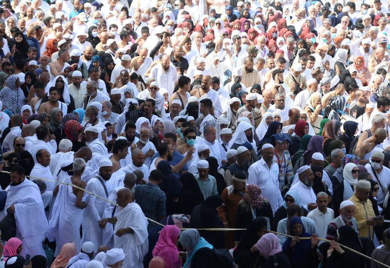 Muslim pilgrims wear protective face masks to prevent contracting coronavirus, as they pray at the Grand mosque in the holy city of Mecca