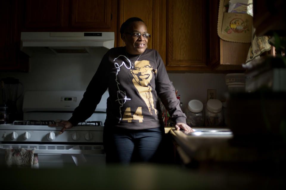 This Jan. 2, 2013, photo, shows Victoria Wimberley, who will be attending President Barack Obama's inauguration for the second time, standing in the kitchen of her home in Decatur, Ga. Four years and one re-election after his historic oath-taking as America's first black president, some of the thrill for Barack Obama is gone. Wimberley brought four busloads of people to Washington for the 2009 inauguration. She's coming again this month, though with two fewer buses, which she blamed on the high price for accommodations, not any lack of excitement for Obama. (AP Photo/David Goldman)