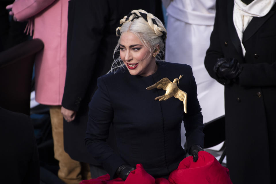 Lady Gaga returns from the podium after signing the National Anthem during the 59th Presidential Inauguration at the U.S. Capitol for President-elect Joe Biden in Washington, Wednesday, Jan. 20, 2021. (Caroline Brehman/Pool Photo via AP) - Credit: Caroline Brehman/Pool Photo via AP