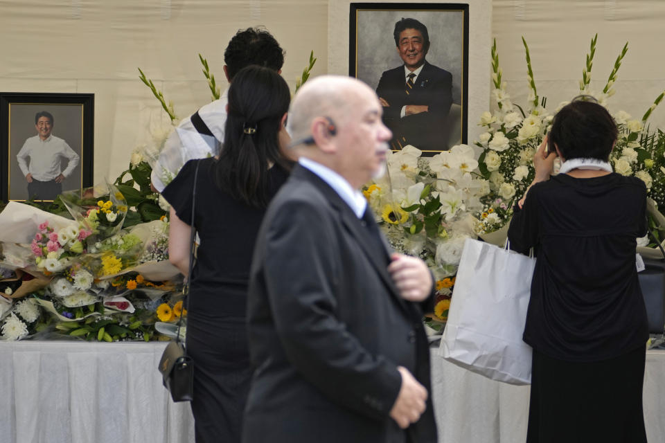 People offer prayers for former Prime Minister Shinzo Abe at Zojoji temple in Tokyo, Japan, Saturday, July 8, 2023. Japan marked first anniversary of the death of Abe who was shot while giving an outdoor campaign speech.(AP Photo/Shuji Kajiyama)