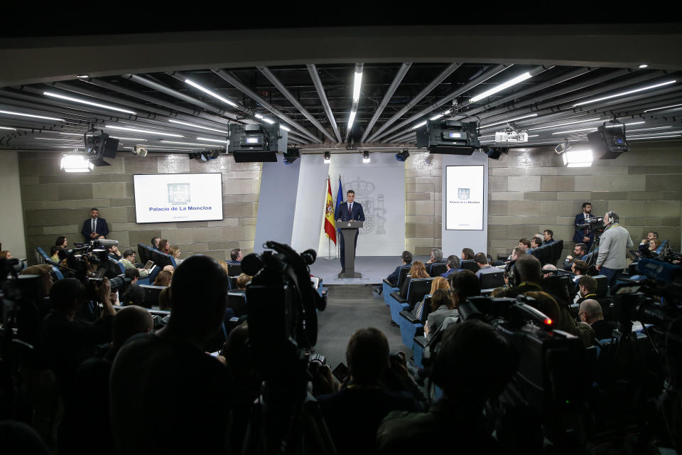 Watched by the media Spain's Prime Minister Pedro Sanchez delivers a statement at the Moncloa Palace in Madrid, Spain, Friday, Feb. 15, 2019.  Sanchez has called early general elections for late April, the third such ballot in less than four years. (AP Photo/Andrea Comas)