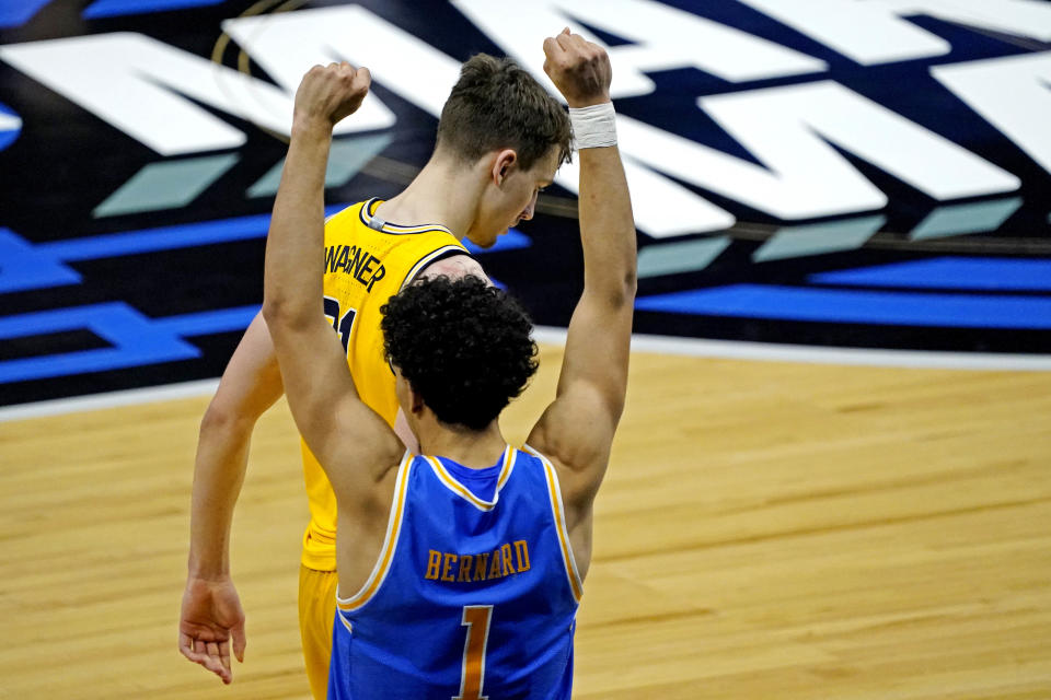 Mar 30, 2021; Indianapolis, IN, USA; UCLA Bruins guard Jules Bernard (1) celebrates in front of Michigan Wolverines guard Franz Wagner (21) after the UCLA Bruins beating the Michigan Wolverines in the Elite Eight of the 2021 NCAA Tournament at Lucas Oil Stadium. Mandatory Credit: Robert Deutsch-USA TODAY Sports