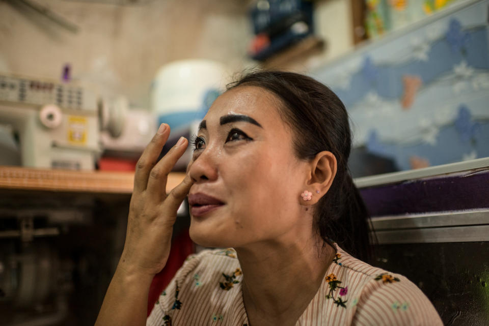 Istiy&nbsp;cries inside her tiny rental room while speaking of&nbsp;the two daughters she left behind in her village. (Photo: Elisabetta Zavoli for HuffPost)