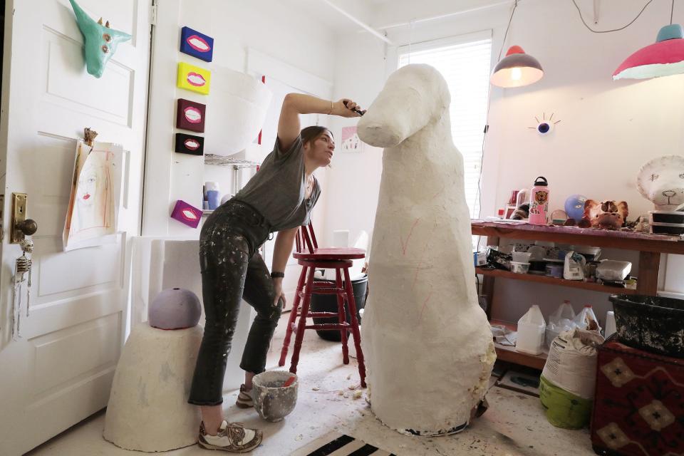 Mere Mason creates a sculptural lion — representing the lion statue in San Marco — for one of the displays in the Wolfson Women's Board's 2022 Winter Design Show. The event benefits Wolfson Children's Hospital.