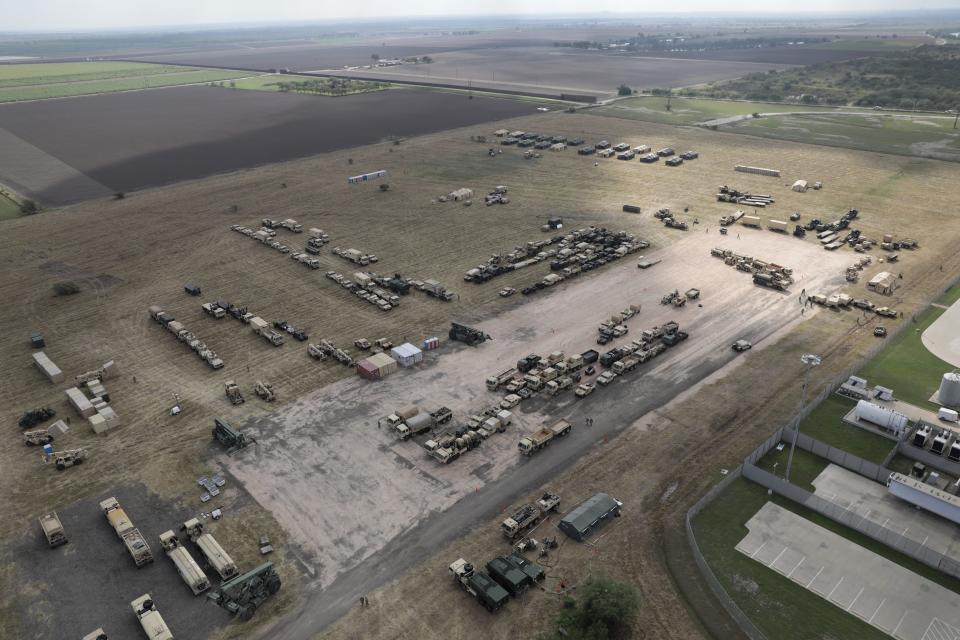 U.S. Army vehicles sit at a military camp under construction at the U.S.-Mexico border on November 7, 2018 in Donna, Texas.