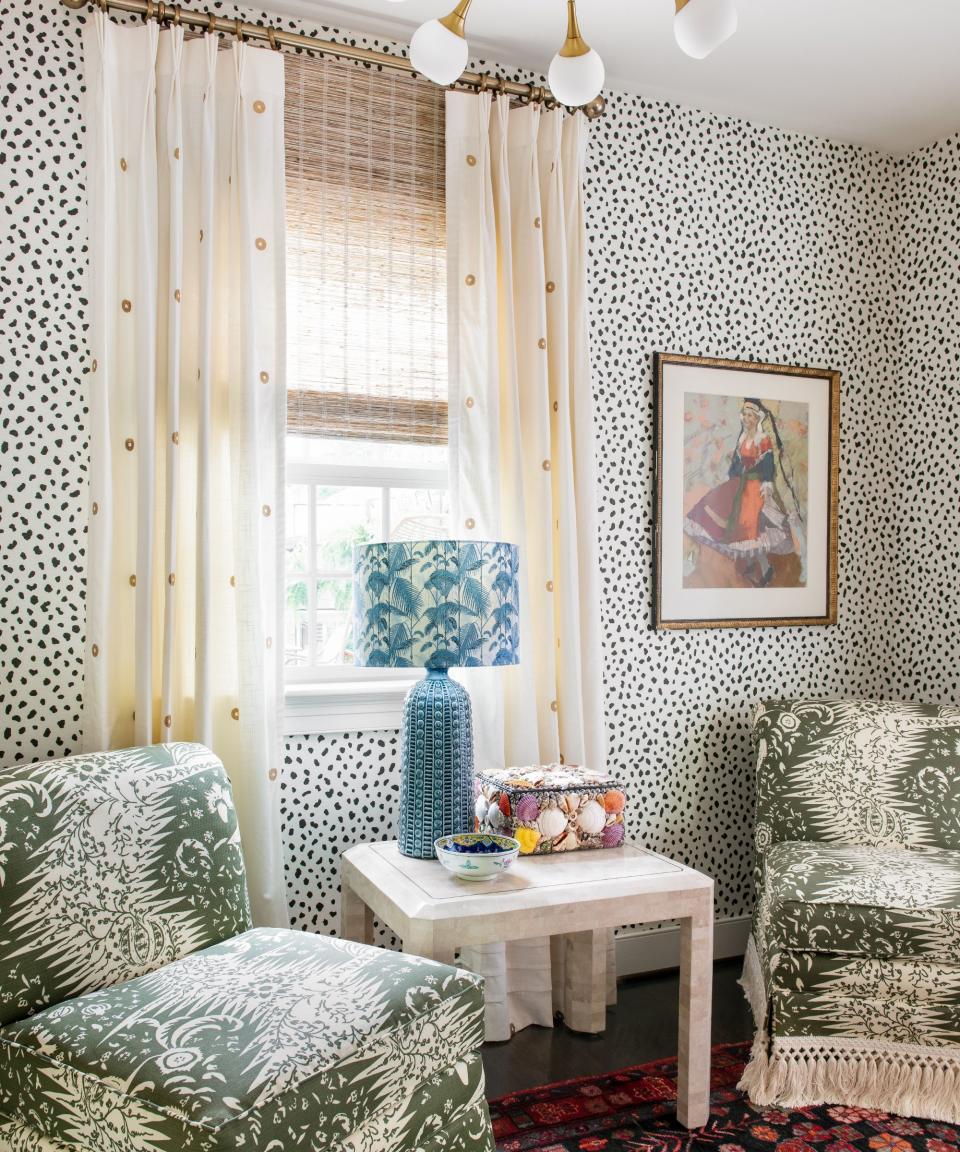 Green chairs, blur lamp, red rug